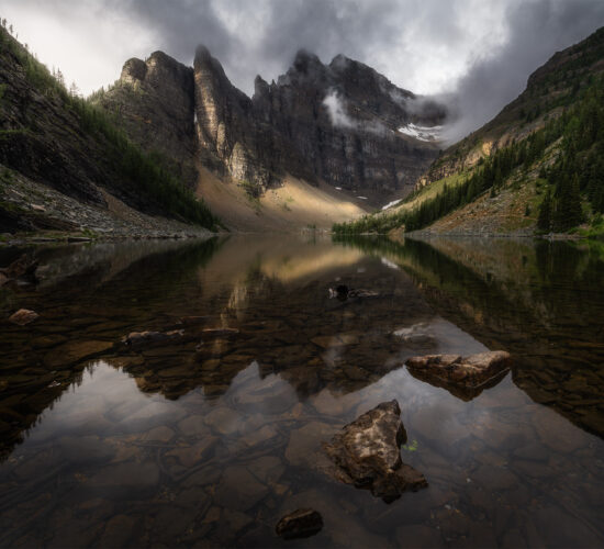 A landscape photograph of Lake Agnes and the Devil's Thumb near the Lake Agnes Teahouse above Lake Louise