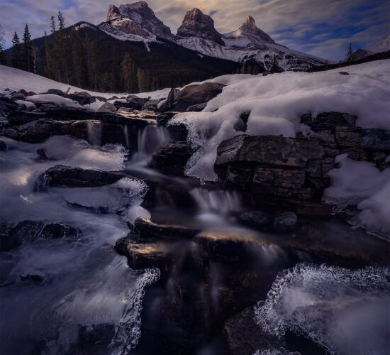 A landscape photograph of the three sisters near canmore alberta